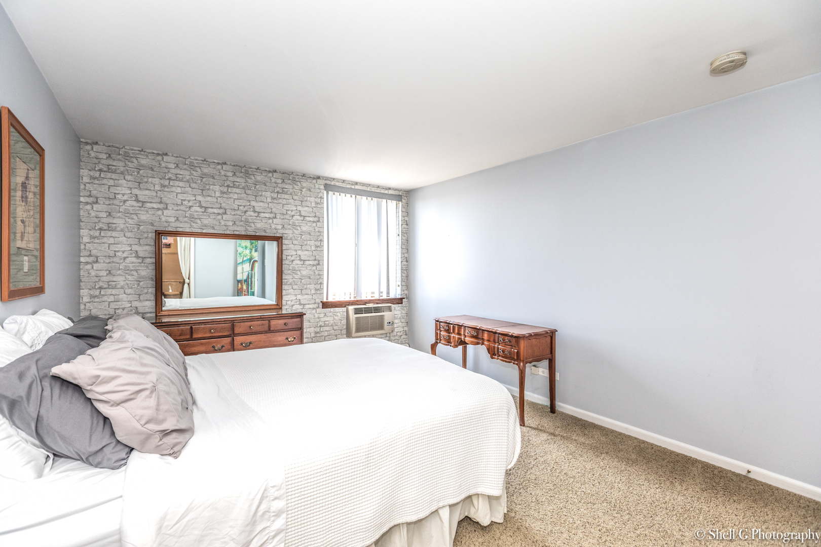 9745 Karlov Avenue, Unit 607 Oak Lawn, IL 60453 - Photo 12 of 16 a bedroom with a bed and window