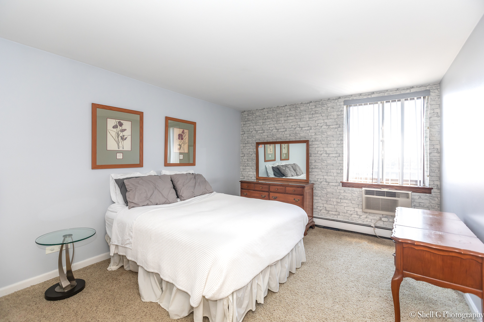 9745 Karlov Avenue, Unit 607 Oak Lawn, IL 60453 - Photo 13 of 16 a spacious bedroom with a bed and window