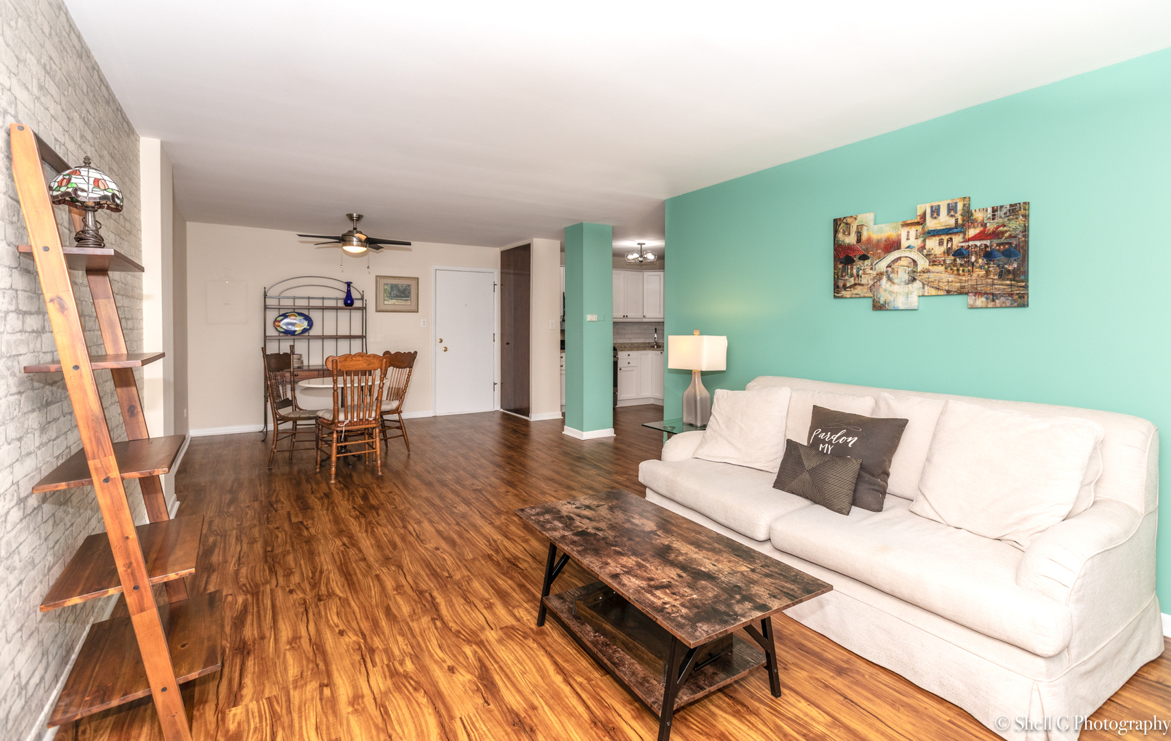 9745 Karlov Avenue, Unit 607 Oak Lawn, IL 60453 - Photo 6 of 16 a living room with furniture and a wooden floor