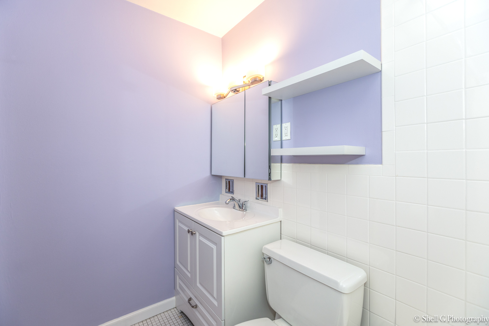 9745 Karlov Avenue, Unit 607 Oak Lawn, IL 60453 - Photo 10 of 16 a bathroom with a toilet sink and mirror