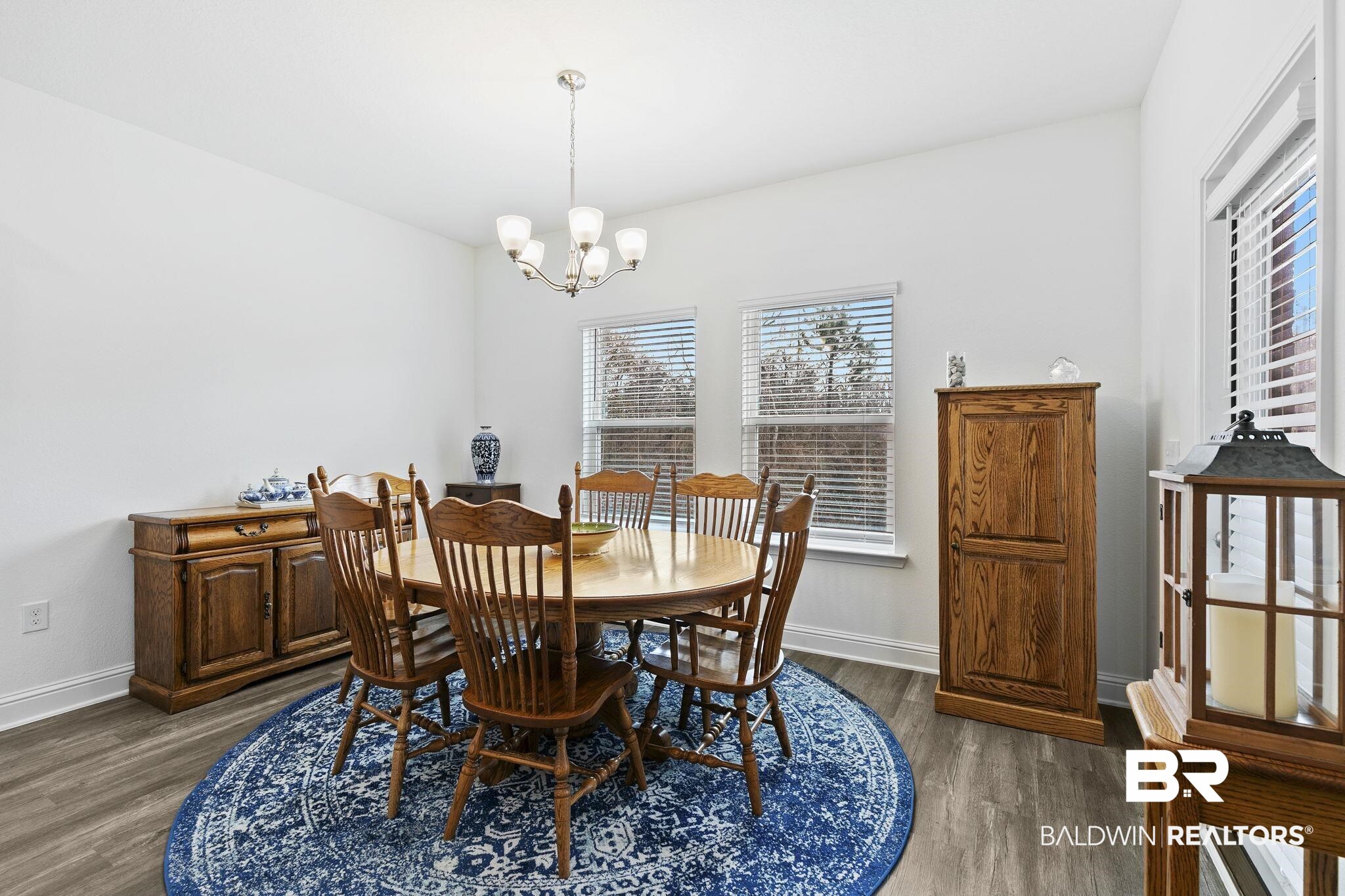1141 Pencarro Boulevard Foley, AL 36535 - Photo 25 of 70 Dining room with a notable chandelier, dark hardwood / wood-style floors, and a healthy amount of sunlight