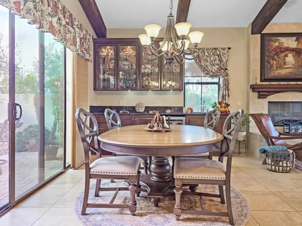 a kitchen with stainless steel appliances granite countertop a stove a sink dishwasher and cabinets with wooden floor