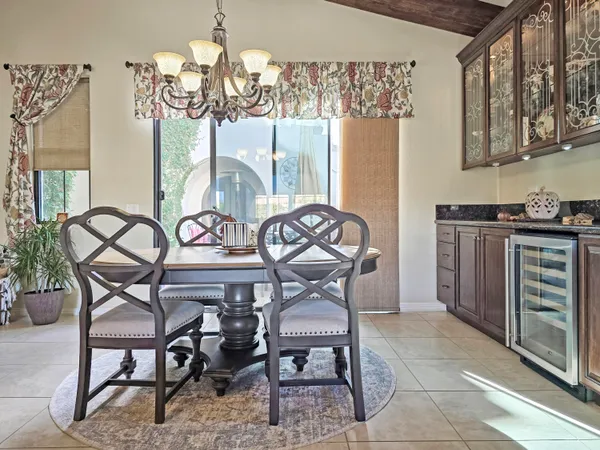 a view of a dining room with furniture and window