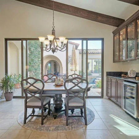 a view of a room that has a table and chairs