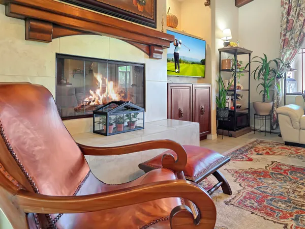 a bedroom with a bed and a bookshelf with wooden floor
