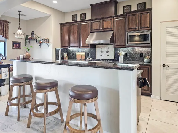 a bathroom with a sink vanity mirror and toilet
