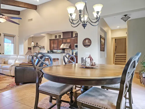a kitchen with stainless steel appliances granite countertop a stove and a refrigerator