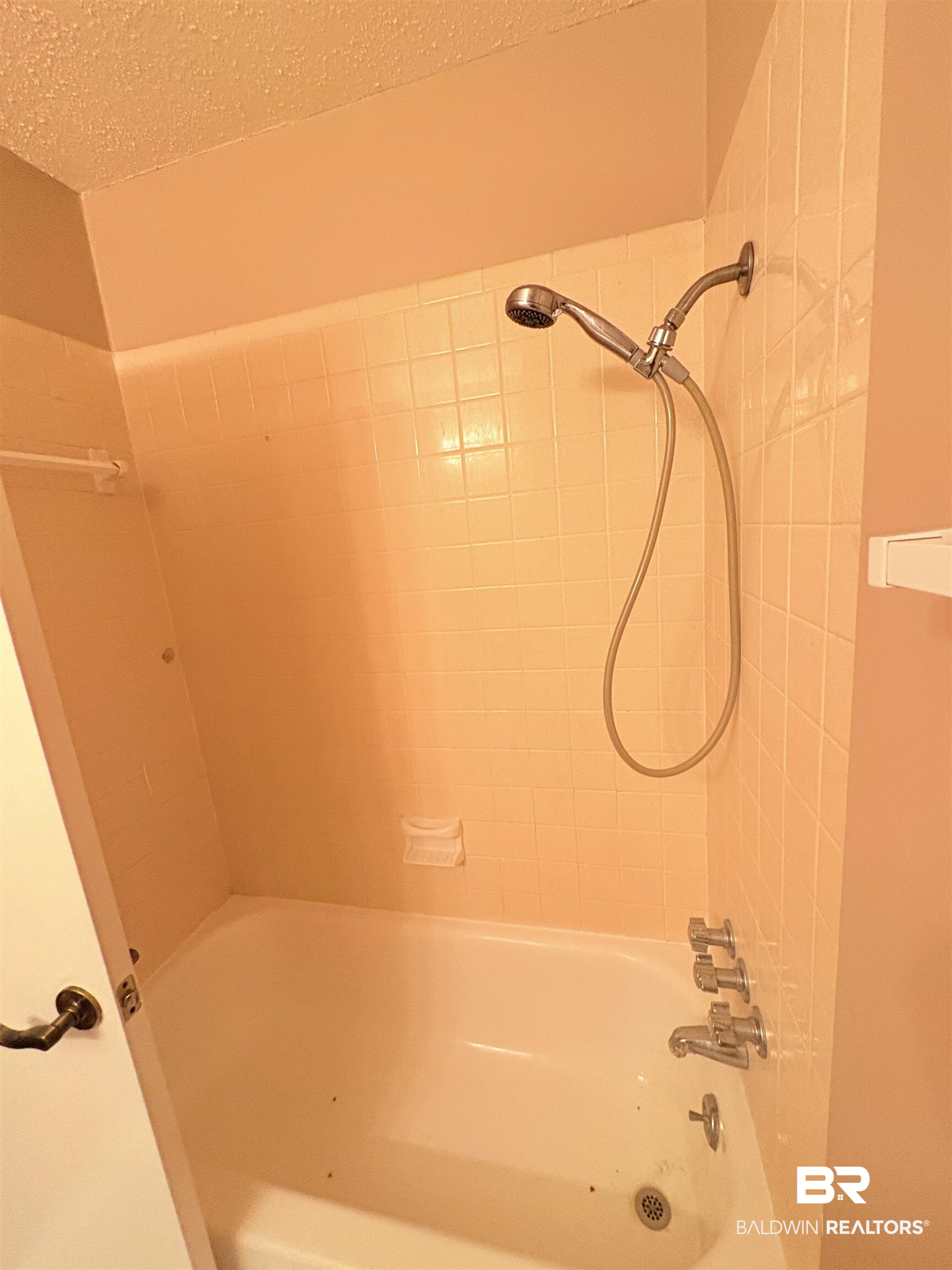 8070 Middle Ring Road Mobile, AL 36619 - Photo 24 of 26 Bathroom with bathtub / shower combination and a textured ceiling