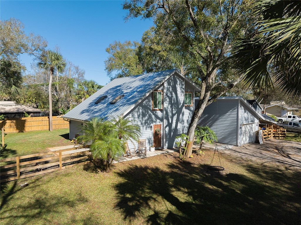 6366 5th Street Vero Beach, FL 32968 - Photo 30 of 36 a view of a house with a yard
