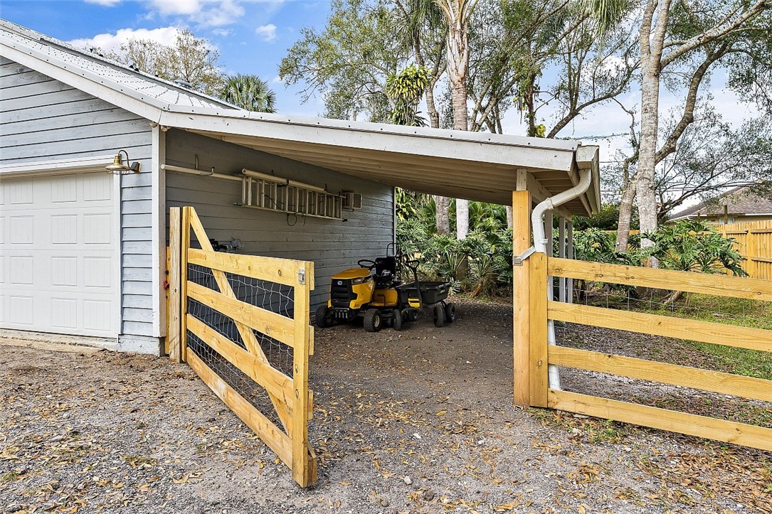 6366 5th Street Vero Beach, FL 32968 - Photo 32 of 36 a view of house with outdoor seating and a large tree
