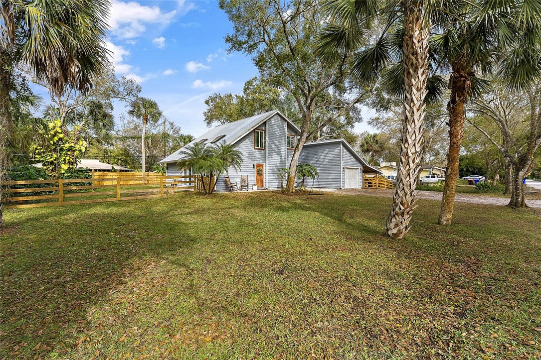 6366 5th Street Vero Beach, FL 32968 - Photo 4 of 36 a view of a house with a yard