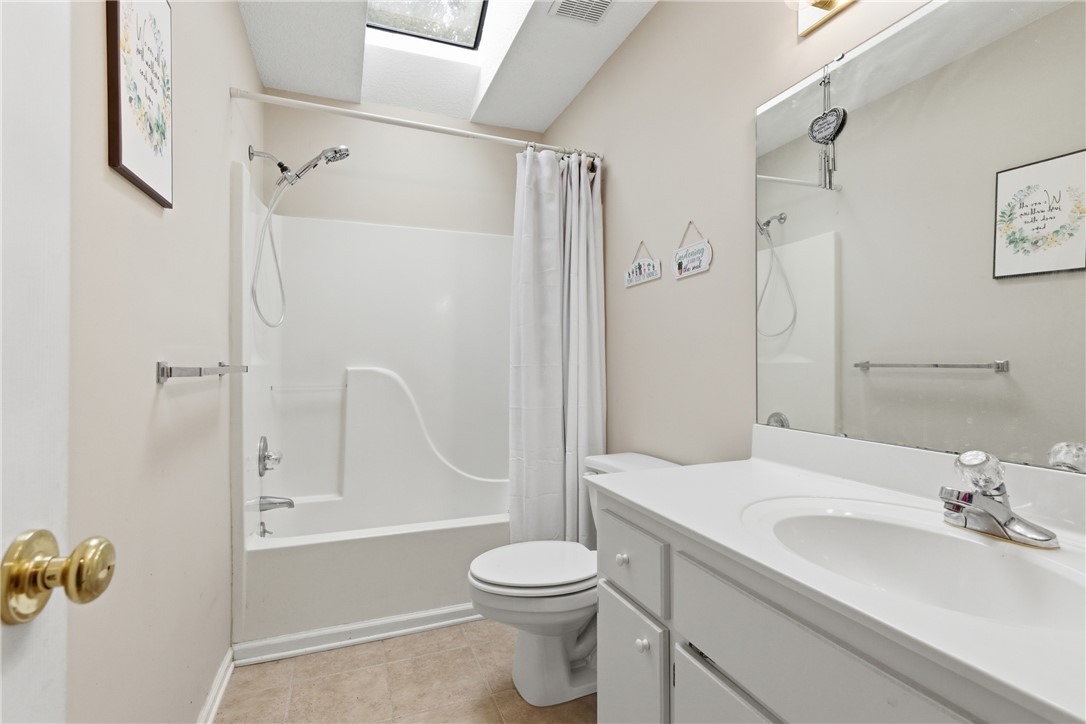 128 Kelly Lane Easley, SC 29642 - Photo 21 of 23 A well-appointed bathroom features a practical vanity with an integrated sink and a tub-shower combination.