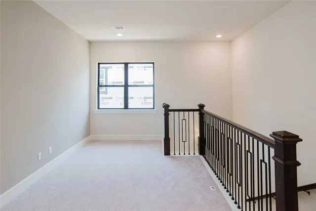 a view of a hallway with windows
