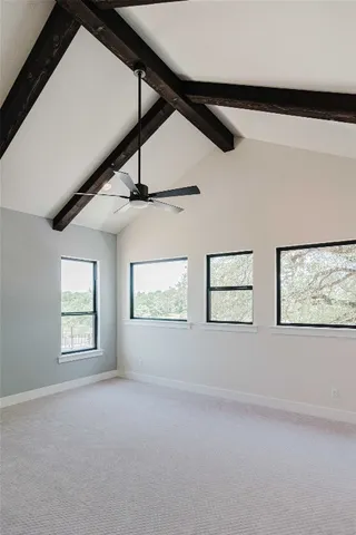 a view of an empty room with windows