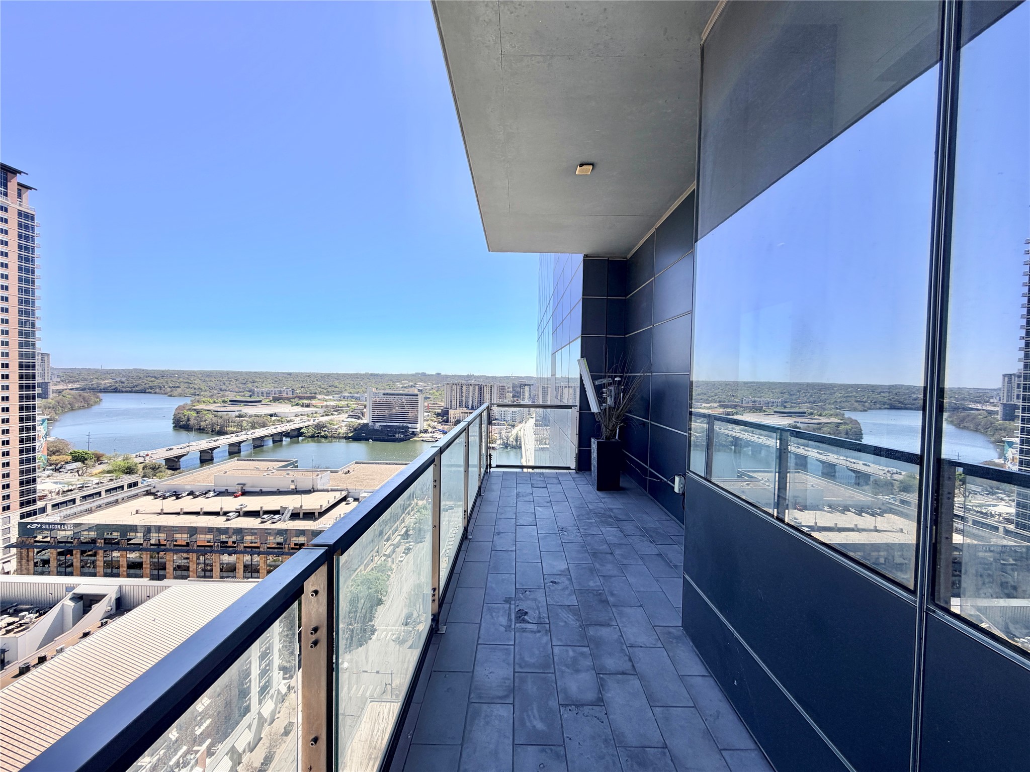 210 Lavaca Street, Unit 1912 Austin, TX 78701 - Photo 12 of 40 Balcony featuring a water view and a city view