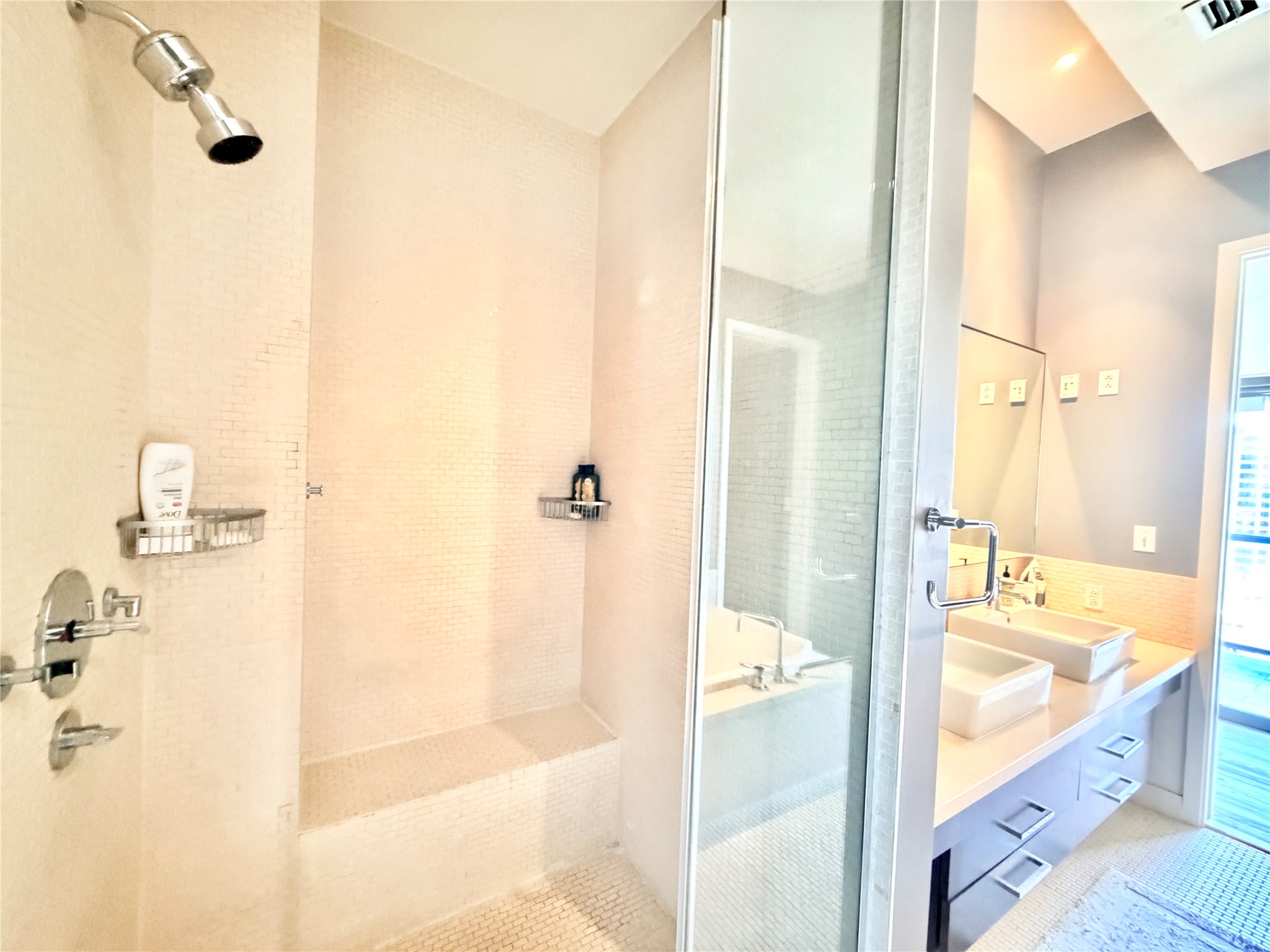 210 Lavaca Street, Unit 1912 Austin, TX 78701 - Photo 14 of 40 Bathroom featuring a shower stall and double vanity