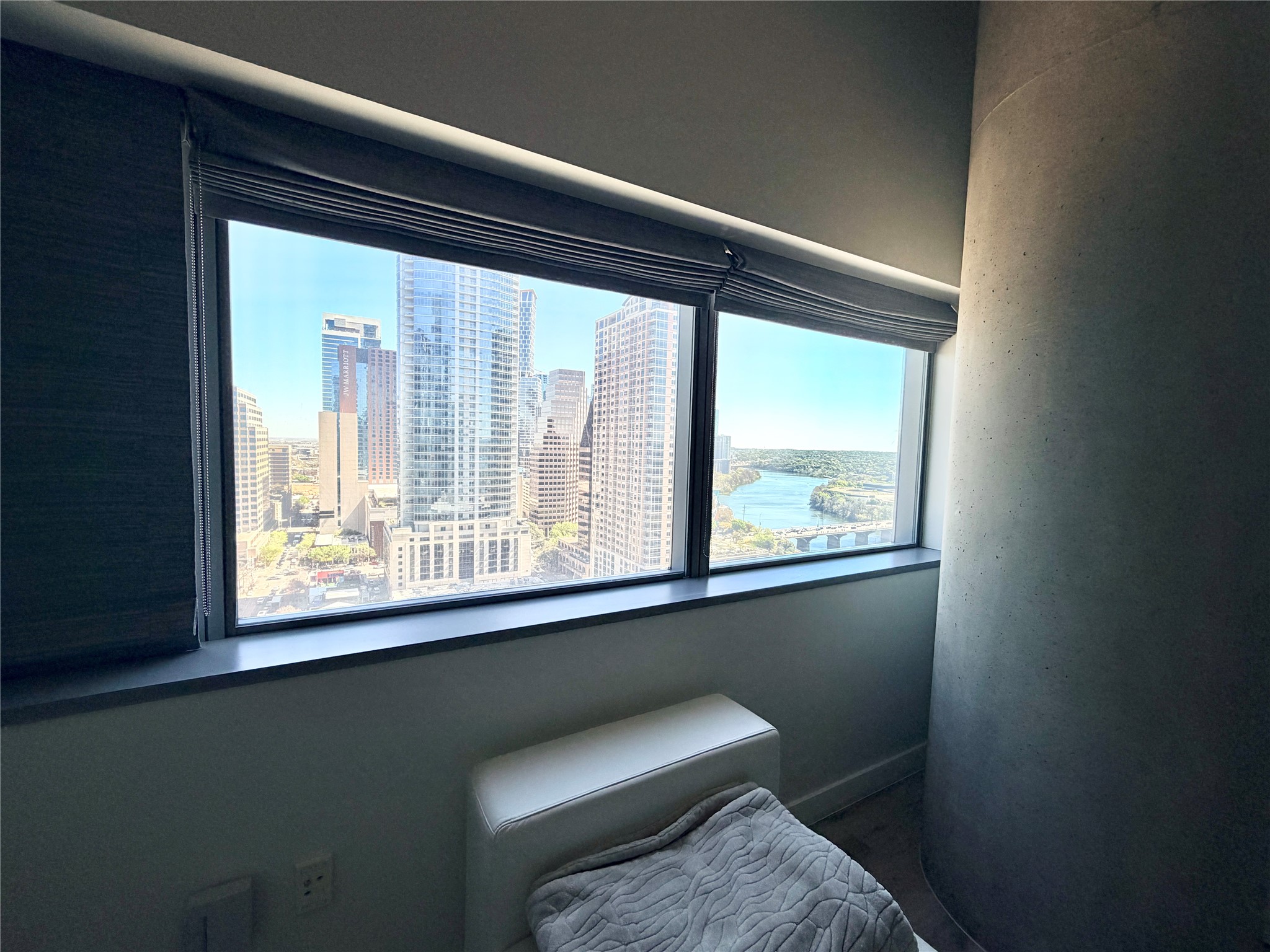 210 Lavaca Street, Unit 1912 Austin, TX 78701 - Photo 19 of 40 Bedroom featuring a water view and a view of skyline