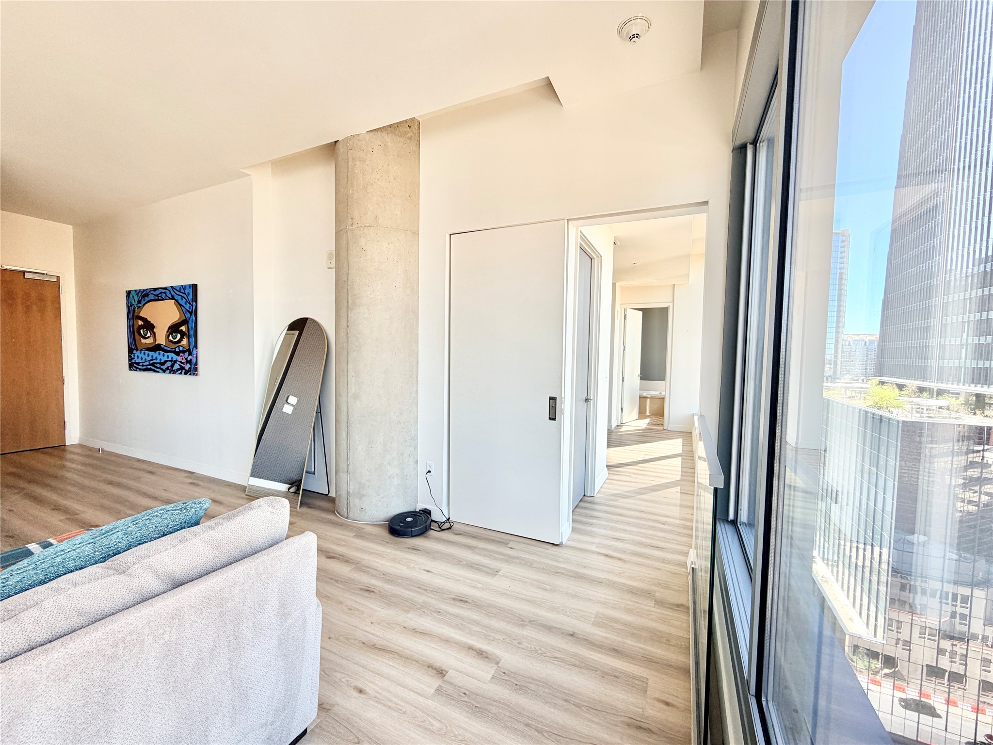 210 Lavaca Street, Unit 1912 Austin, TX 78701 - Photo 24 of 40 Living room with light wood finished floors