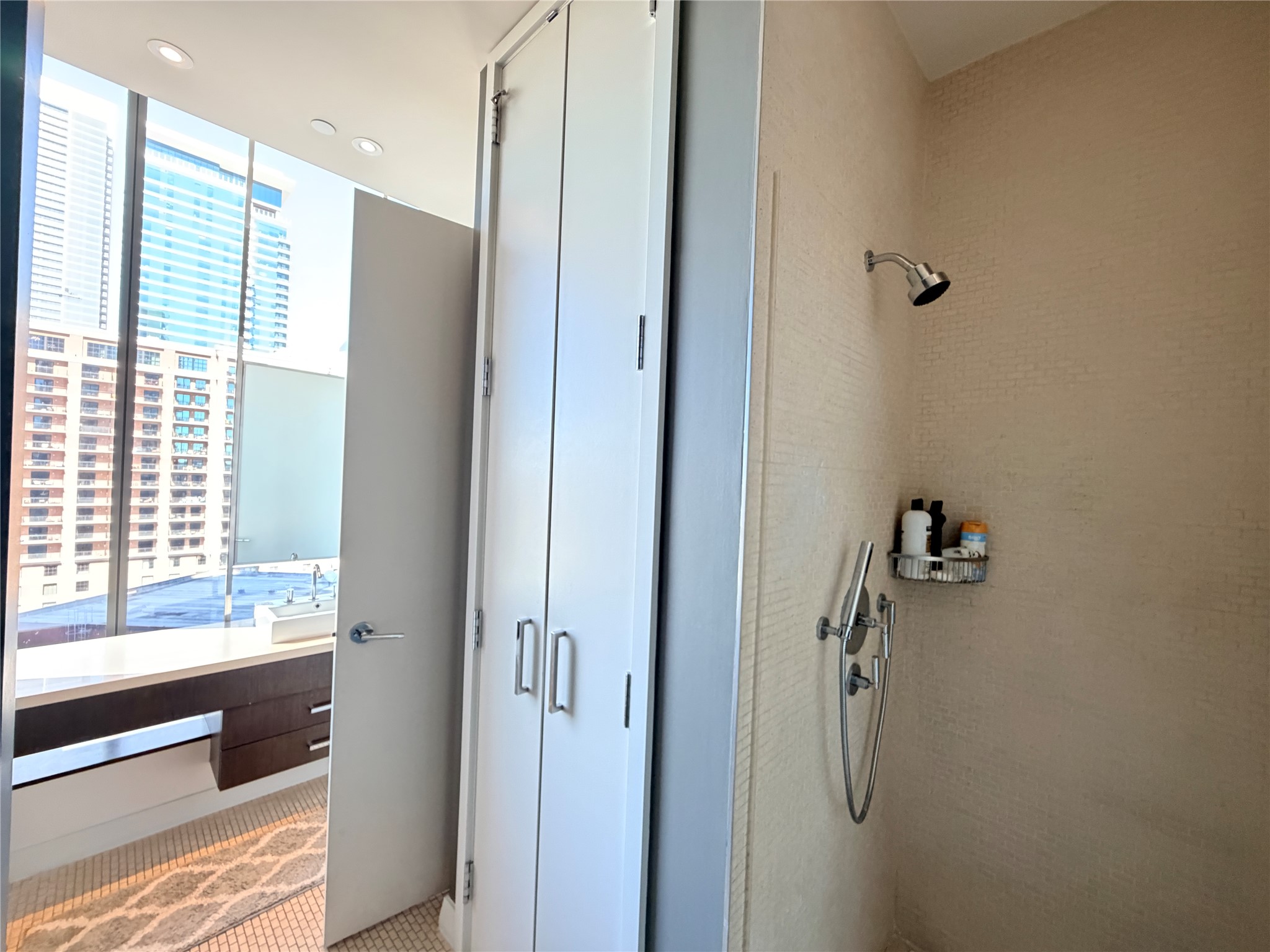 210 Lavaca Street, Unit 1912 Austin, TX 78701 - Photo 29 of 40 Full bath with a tile shower and a sink