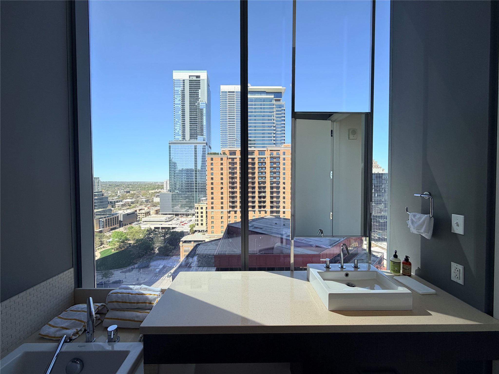 210 Lavaca Street, Unit 1912 Austin, TX 78701 - Photo 31 of 40 Full bath with a view of city, vanity, and a garden tub