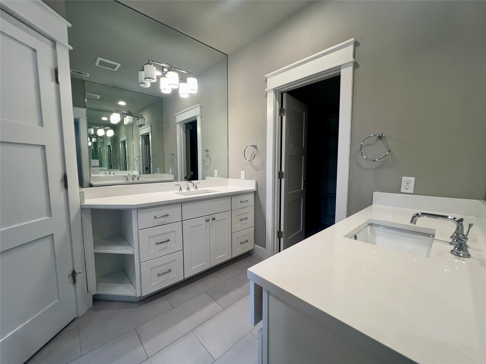 6515 Davis Lane, Unit 10 Austin, TX 78749 - Photo 13 of 22 Ample counter space and dual sinks define this bright, well-appointed bathroom.