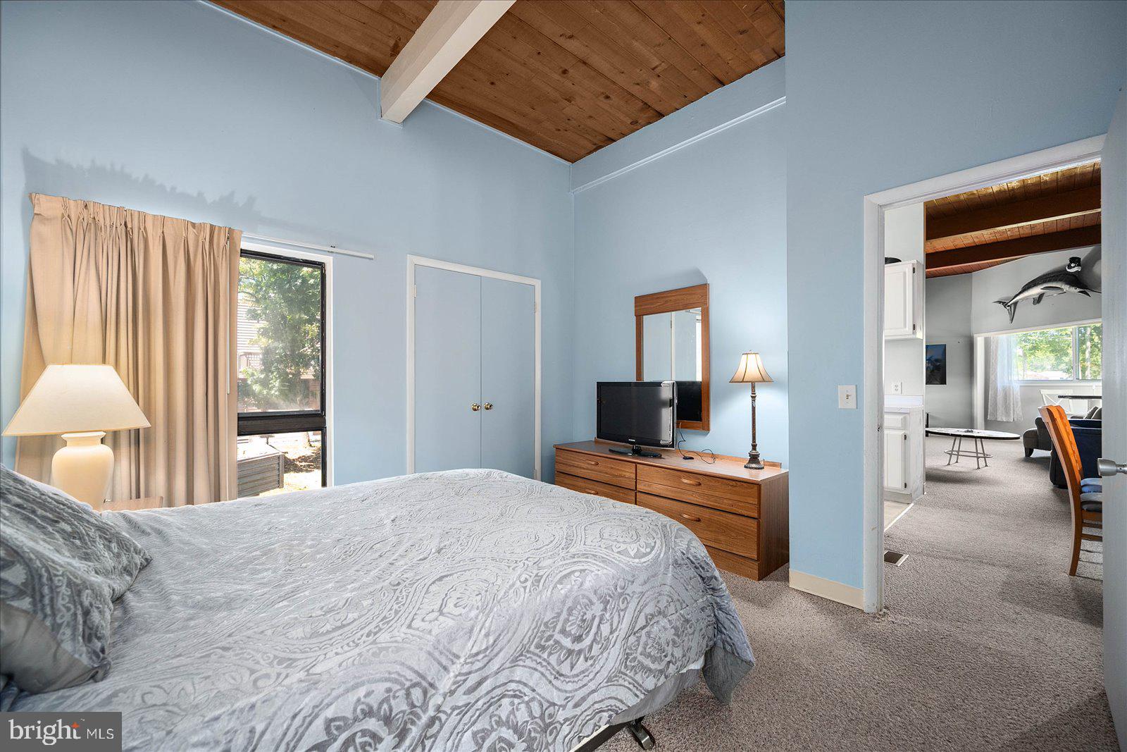 438 Ocean Parkway, Unit 35 Ocean Pines, MD 21811 - Photo 18 of 99 a bedroom with a bed and a flat screen tv