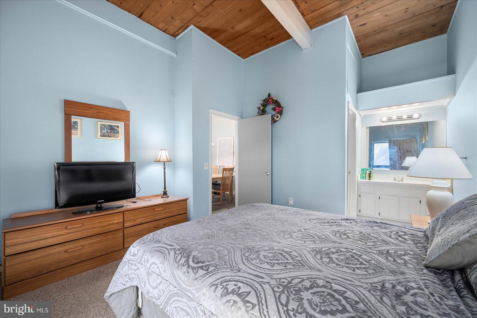 438 Ocean Parkway, Unit 35 Ocean Pines, MD 21811 - Photo 20 of 99 a bedroom with a bed and a flat screen tv