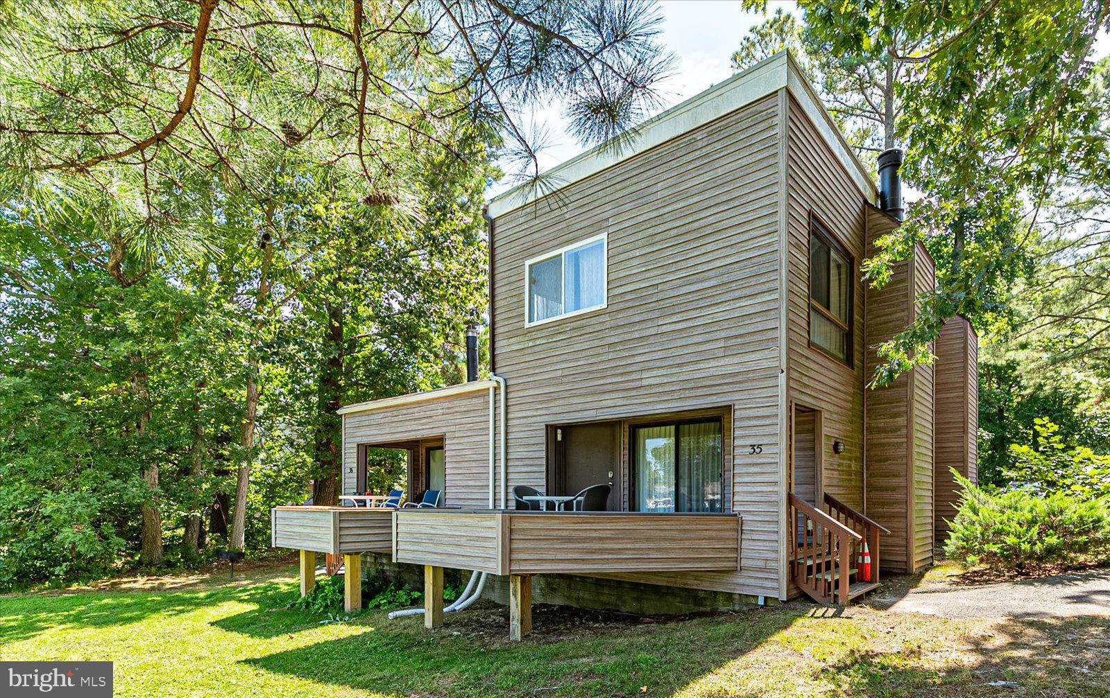 438 Ocean Parkway, Unit 35 Ocean Pines, MD 21811 - Photo 2 of 99 a view of house with backyard and a garden