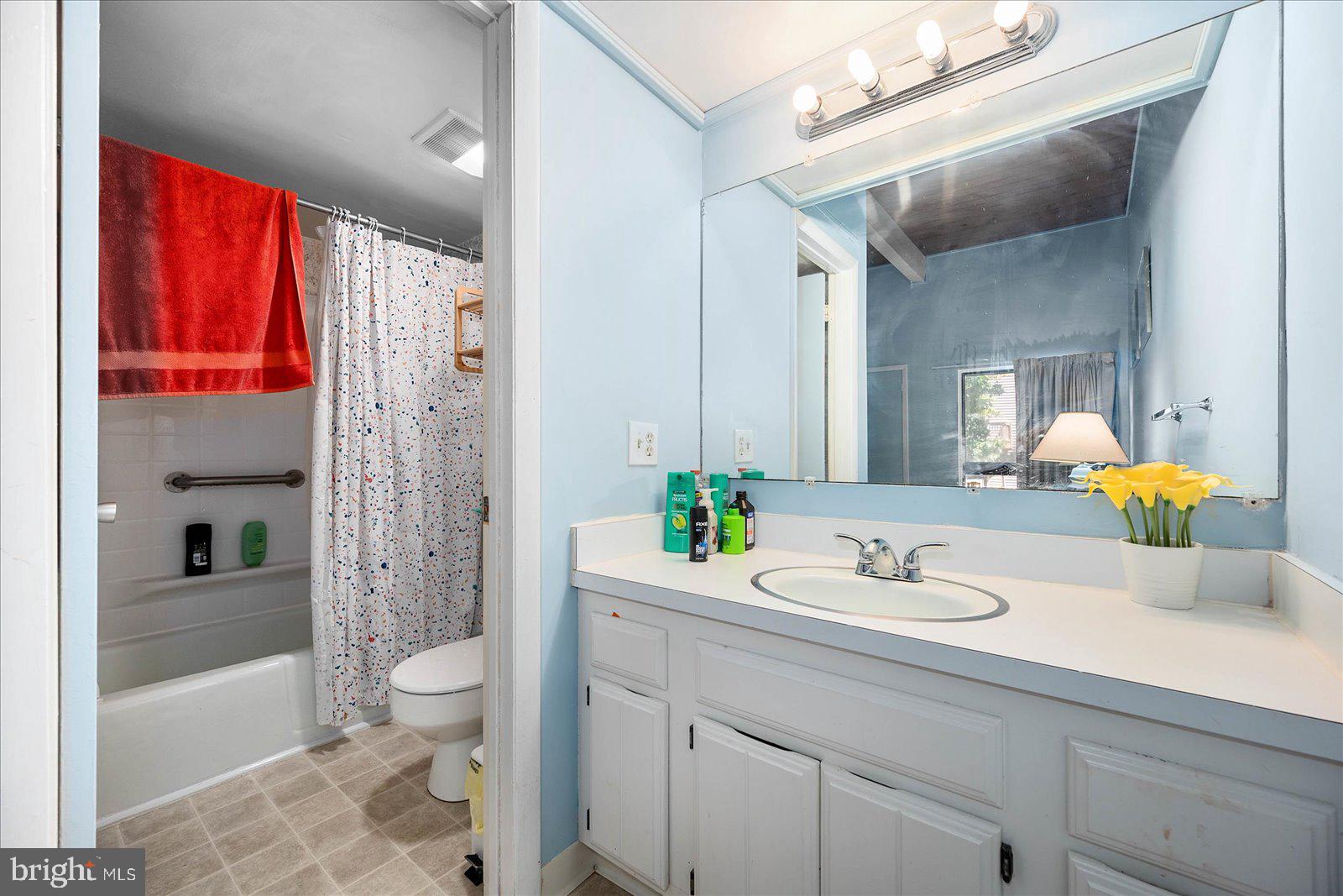 438 Ocean Parkway, Unit 35 Ocean Pines, MD 21811 - Photo 21 of 99 a bathroom with a sink toilet and shower