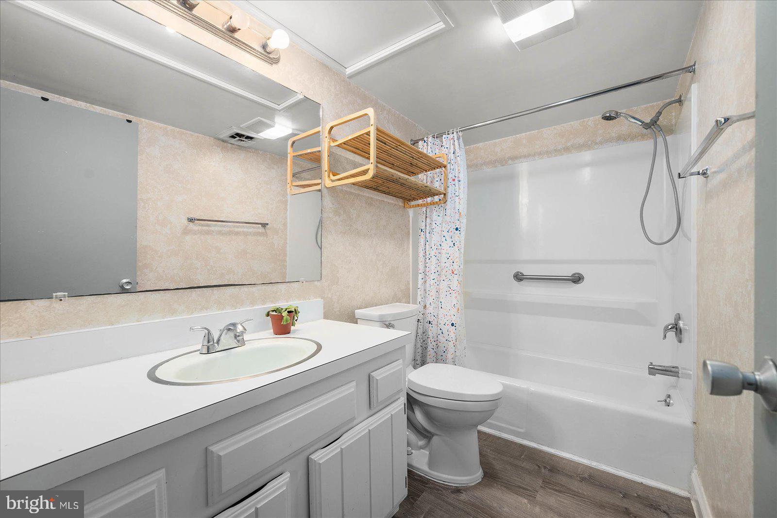 438 Ocean Parkway, Unit 35 Ocean Pines, MD 21811 - Photo 25 of 99 a bathroom with a sink toilet tub and shower