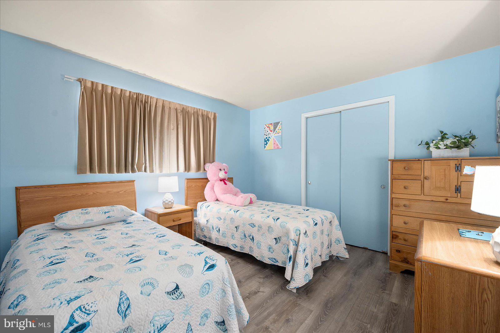 438 Ocean Parkway, Unit 35 Ocean Pines, MD 21811 - Photo 26 of 99 a bedroom with two beds and a closet