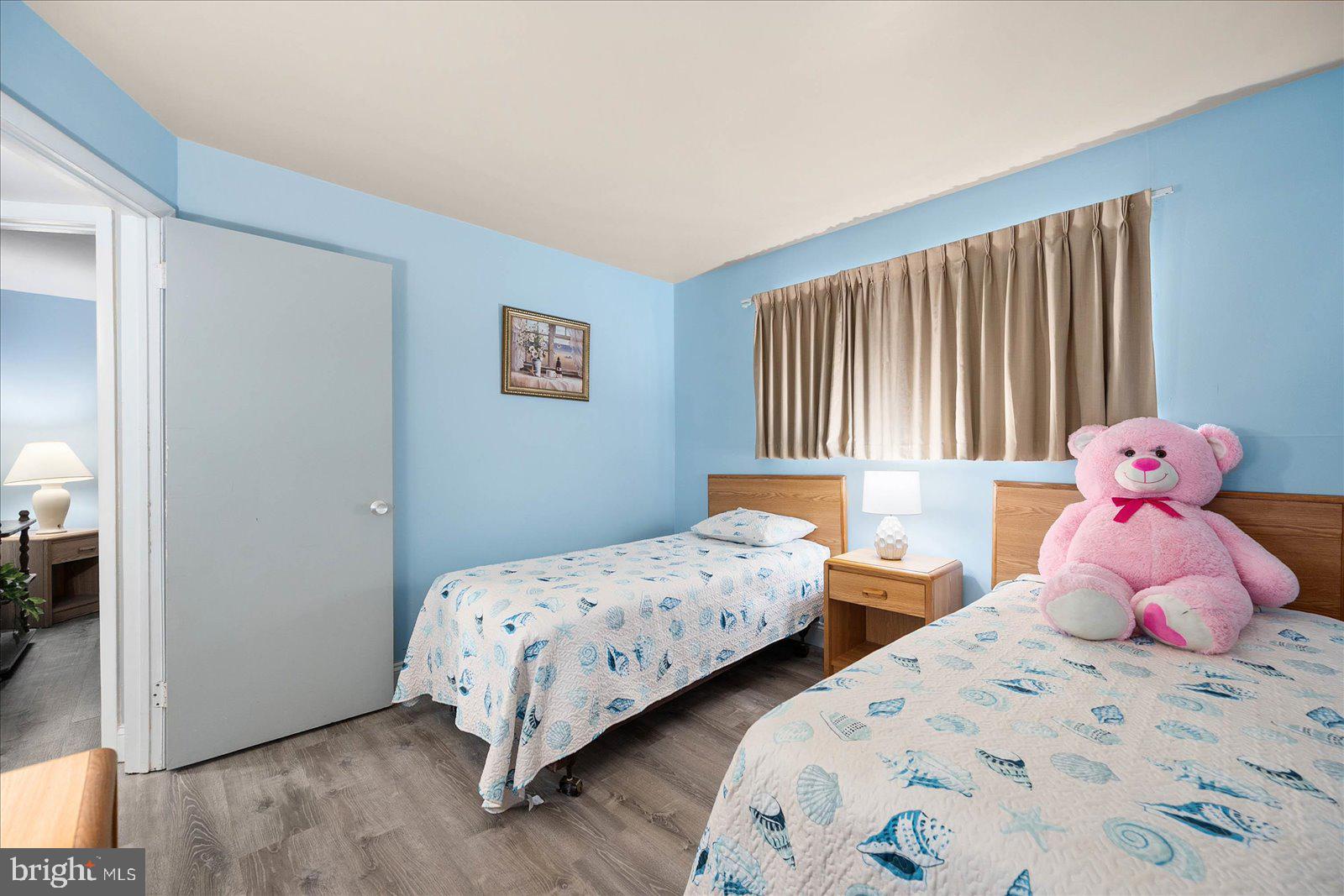 438 Ocean Parkway, Unit 35 Ocean Pines, MD 21811 - Photo 27 of 99 a bedroom with two beds and painting on the wall