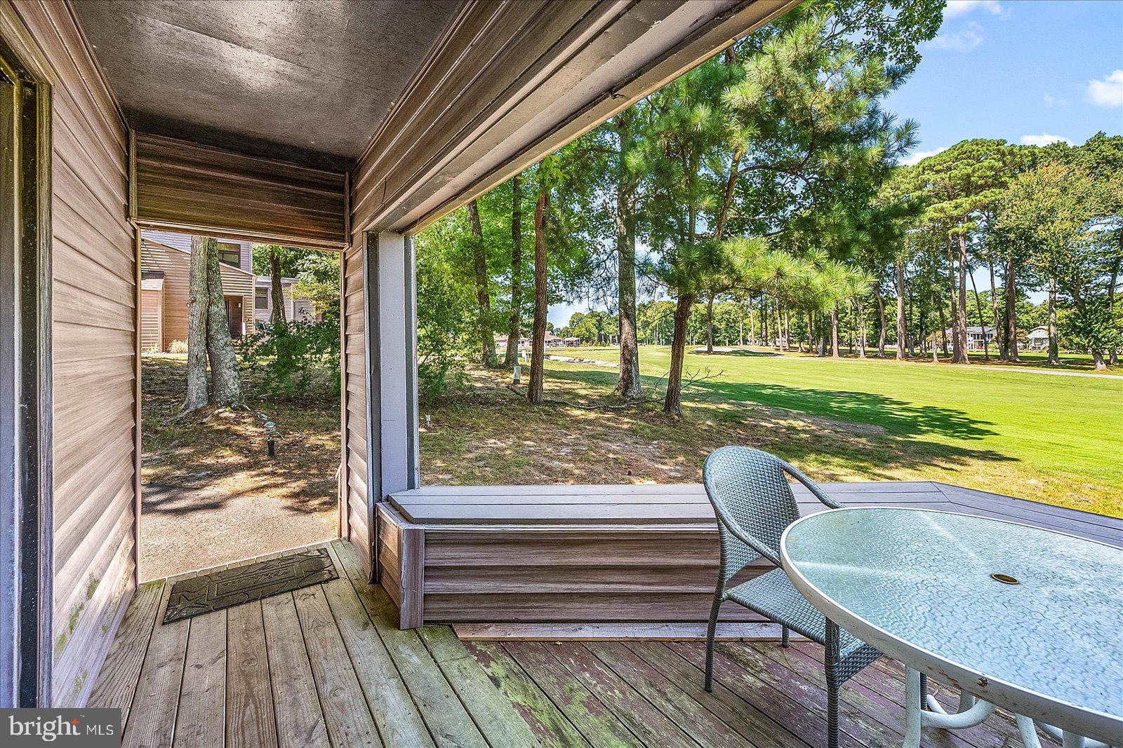 438 Ocean Parkway, Unit 35 Ocean Pines, MD 21811 - Photo 32 of 99 a view of a two chairs in the patio next to a yard