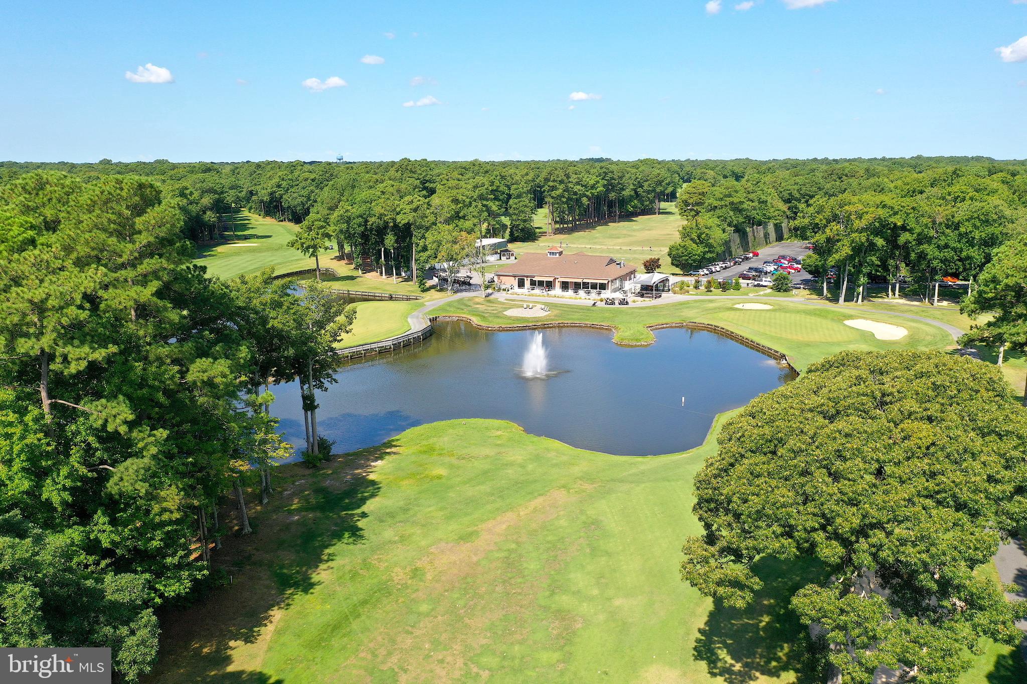 438 Ocean Parkway, Unit 35 Ocean Pines, MD 21811 - Photo 45 of 99 a view of a swimming pool with an outdoor seating and yard