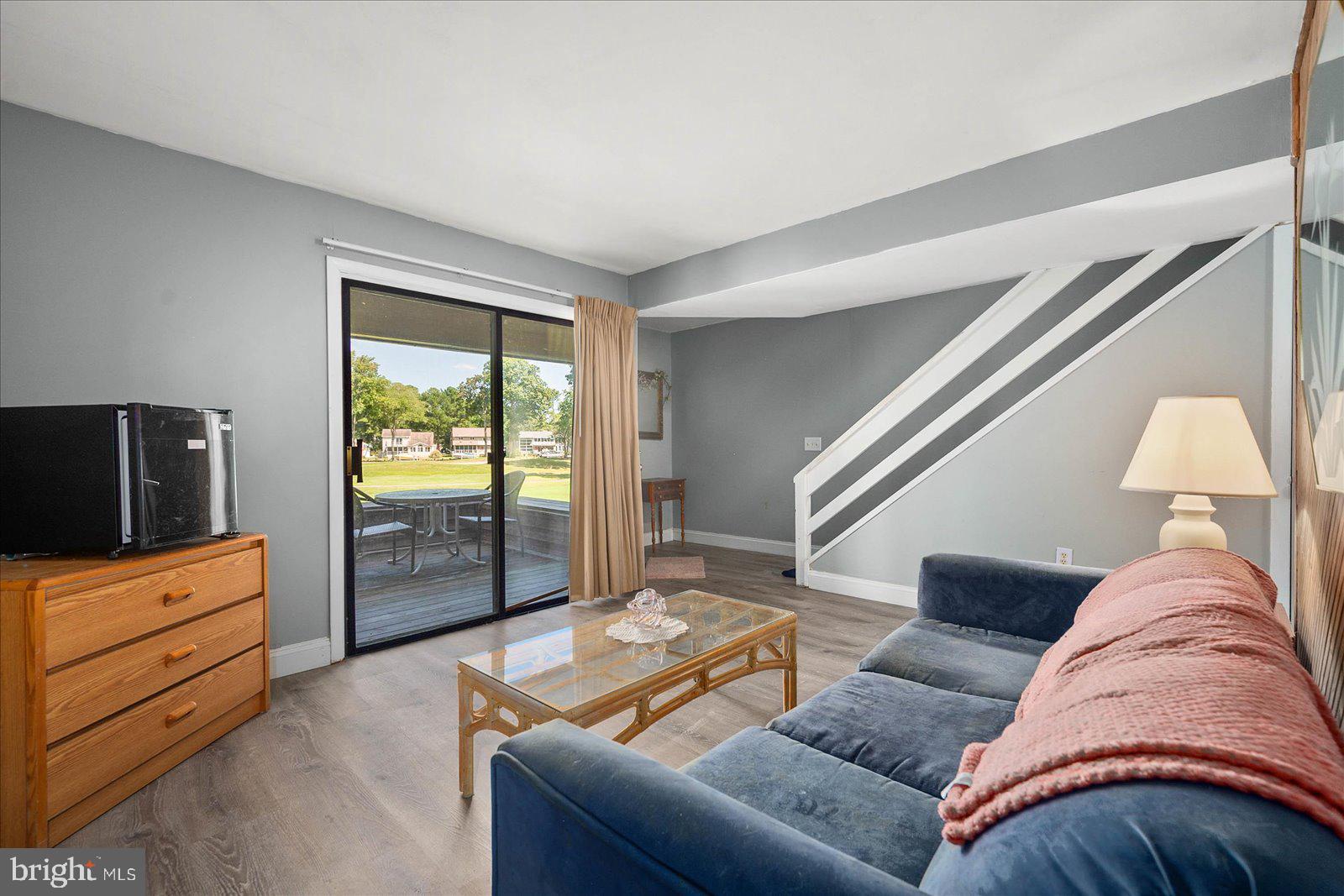 438 Ocean Parkway, Unit 35 Ocean Pines, MD 21811 - Photo 5 of 99 a living room with furniture and a flat screen tv