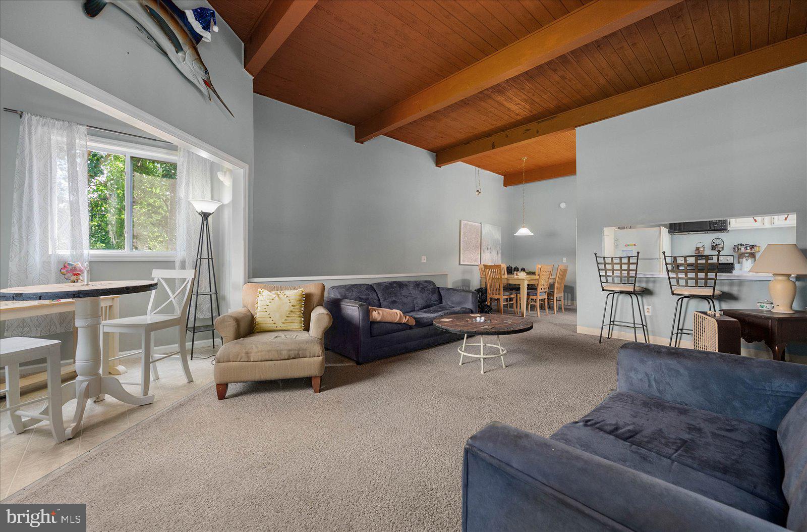 438 Ocean Parkway, Unit 35 Ocean Pines, MD 21811 - Photo 9 of 99 a living room with furniture and a large window