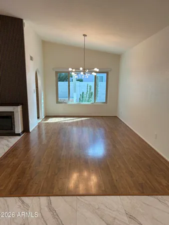 a view of a big room with windows and stairs