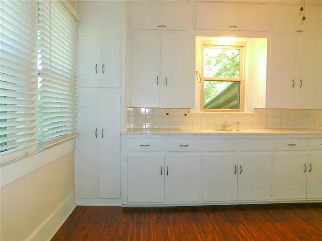 a bathroom with a sink and a window