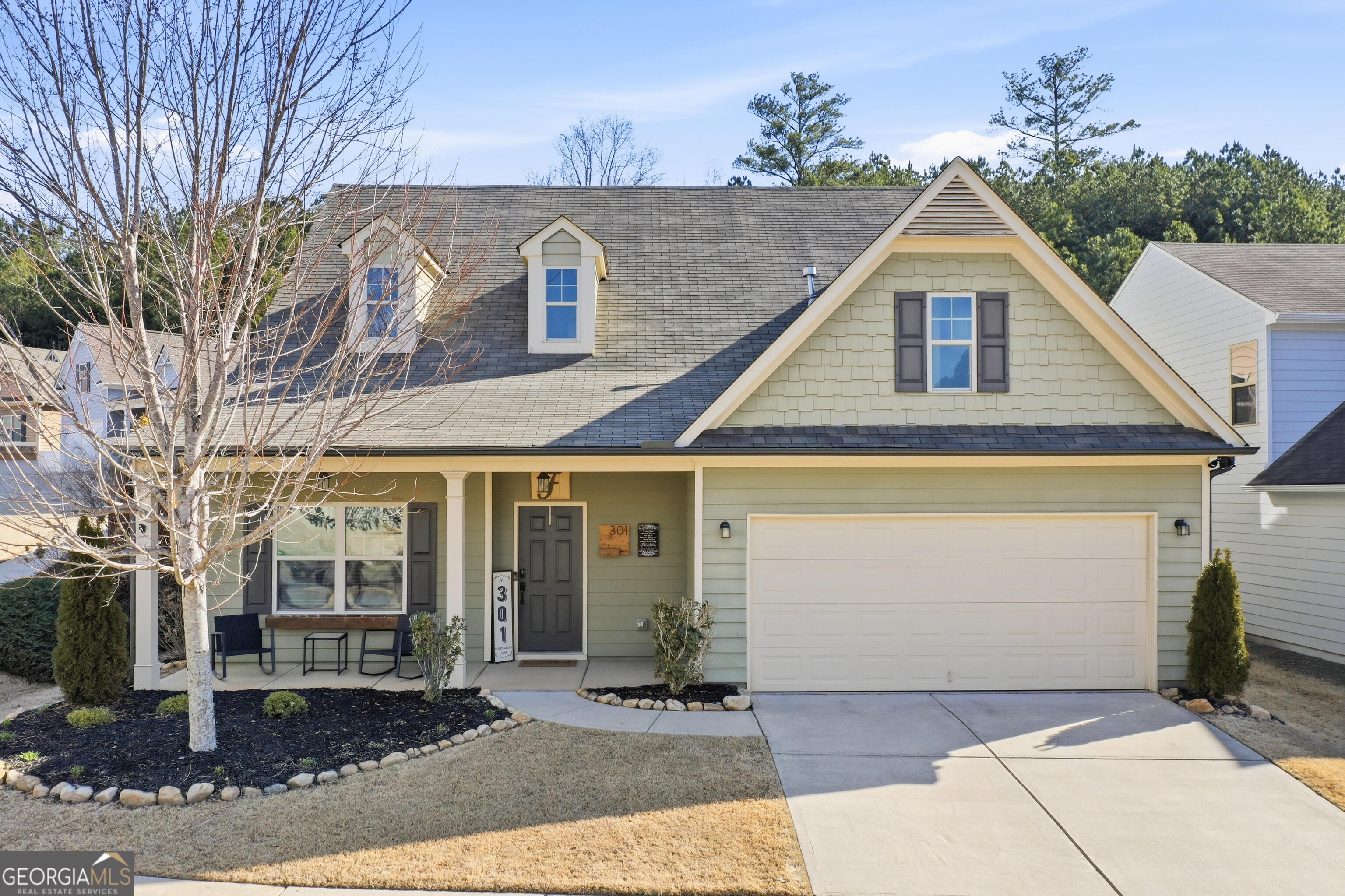 301 Stoney Hollow Road Canton, GA 30114 - Photo 1 of 47 a front view of a house with a yard