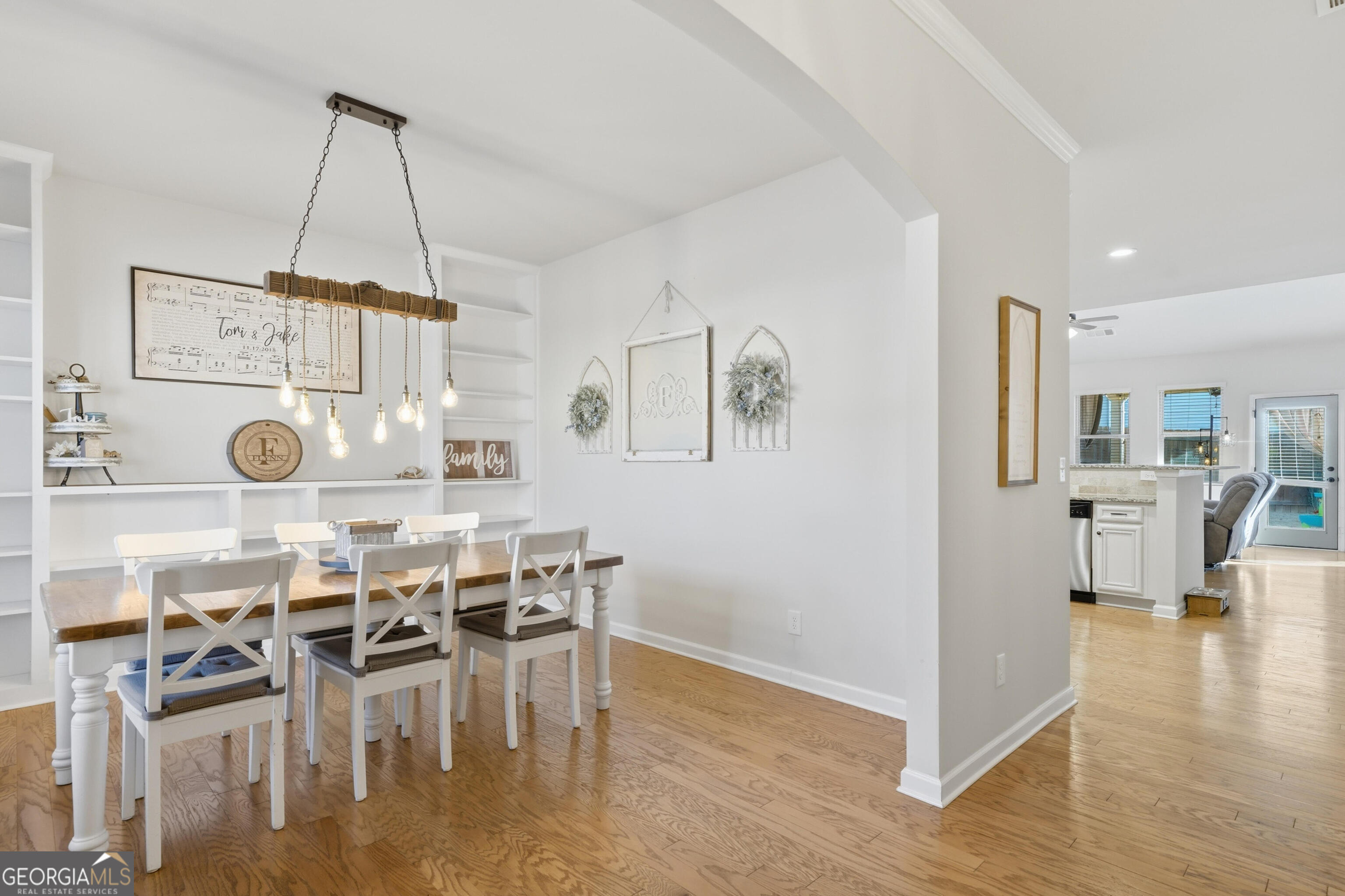 301 Stoney Hollow Road Canton, GA 30114 - Photo 12 of 47 a view of a dining room with furniture and wooden floor