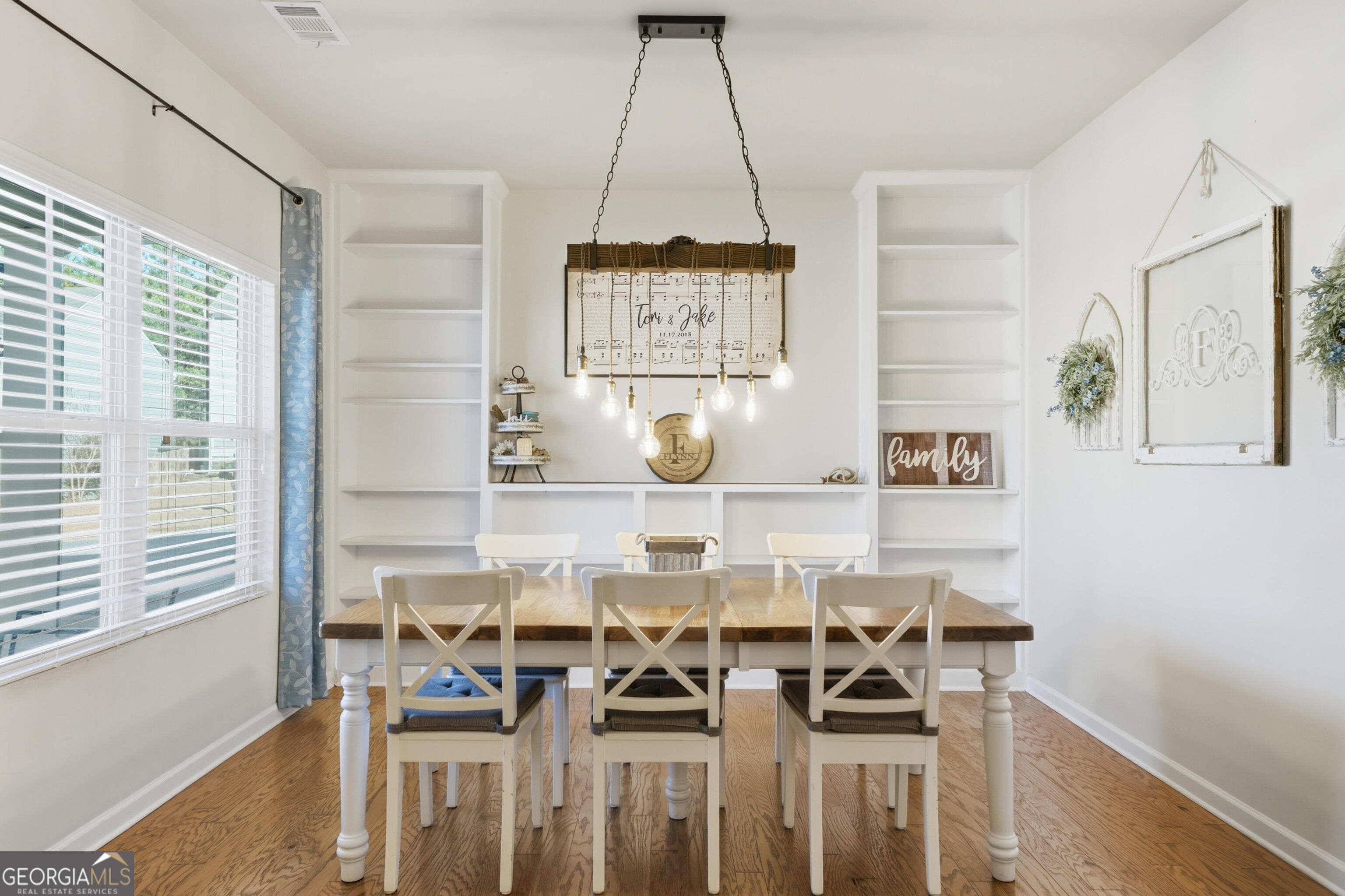 301 Stoney Hollow Road Canton, GA 30114 - Photo 13 of 47 a picture of a table and chairs in a room