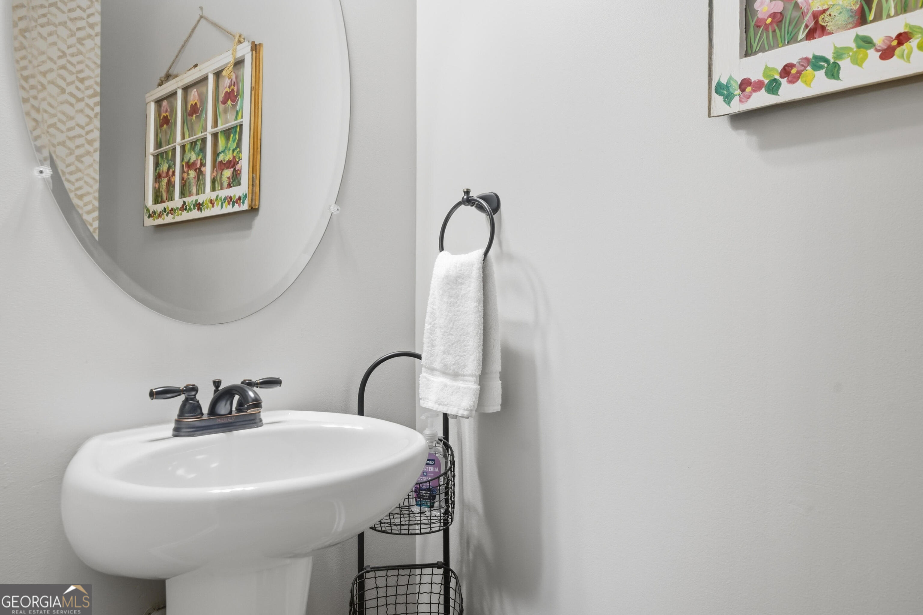 301 Stoney Hollow Road Canton, GA 30114 - Photo 14 of 47 a bathroom with a sink and mirror