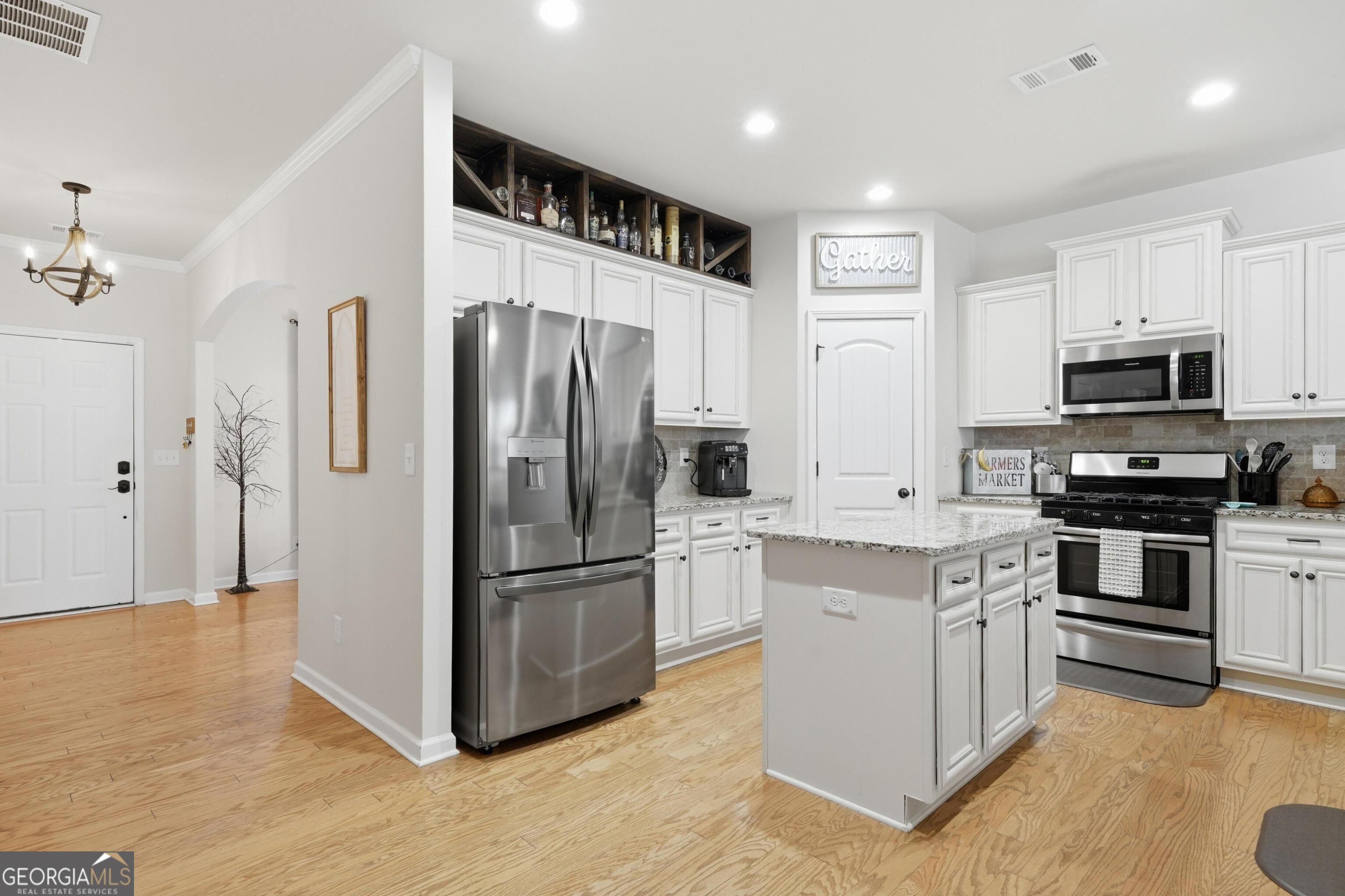 301 Stoney Hollow Road Canton, GA 30114 - Photo 17 of 47 a kitchen with stainless steel appliances granite countertop a refrigerator a stove a sink and a microwave
