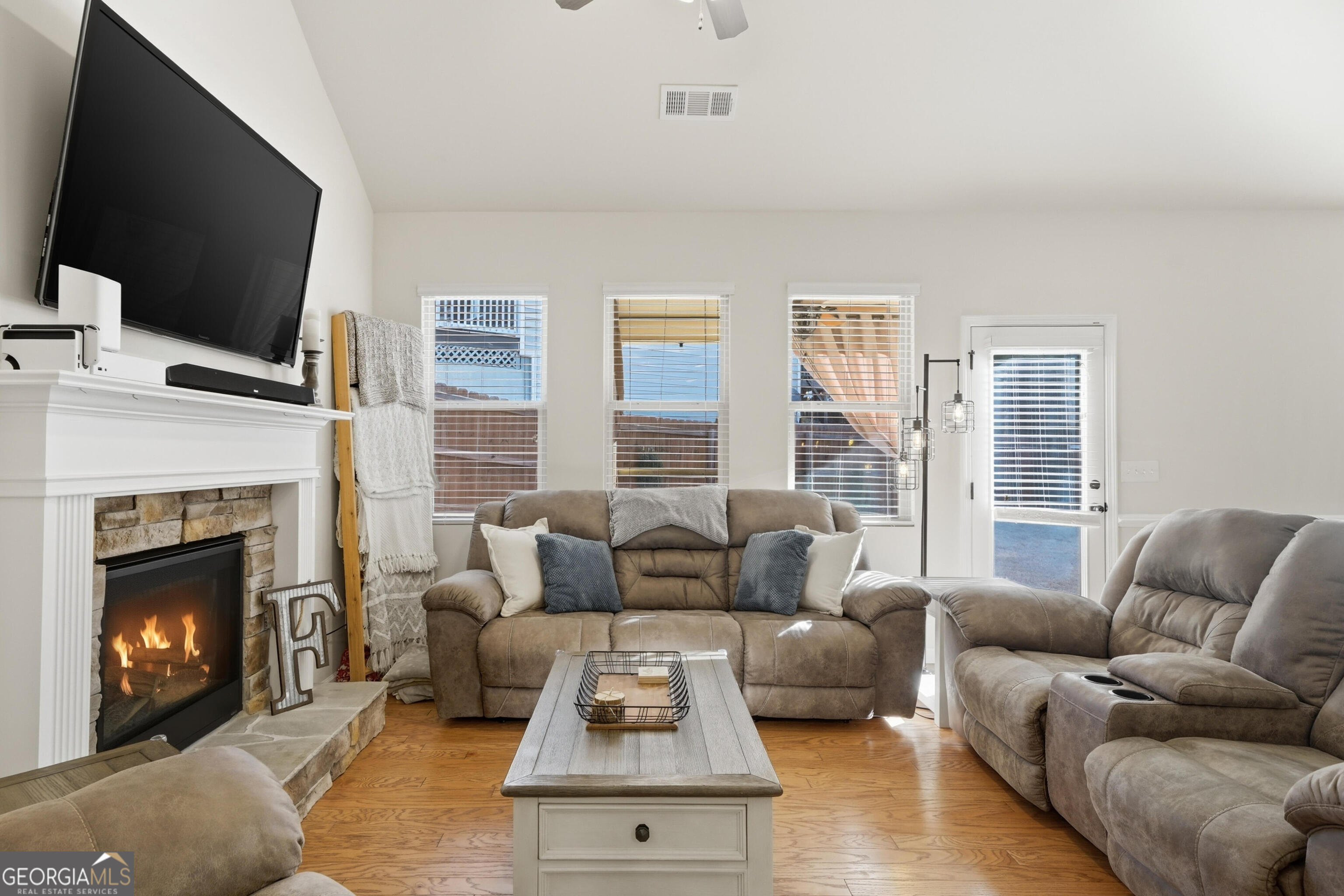 301 Stoney Hollow Road Canton, GA 30114 - Photo 23 of 47 a living room with furniture fireplace and flat screen tv