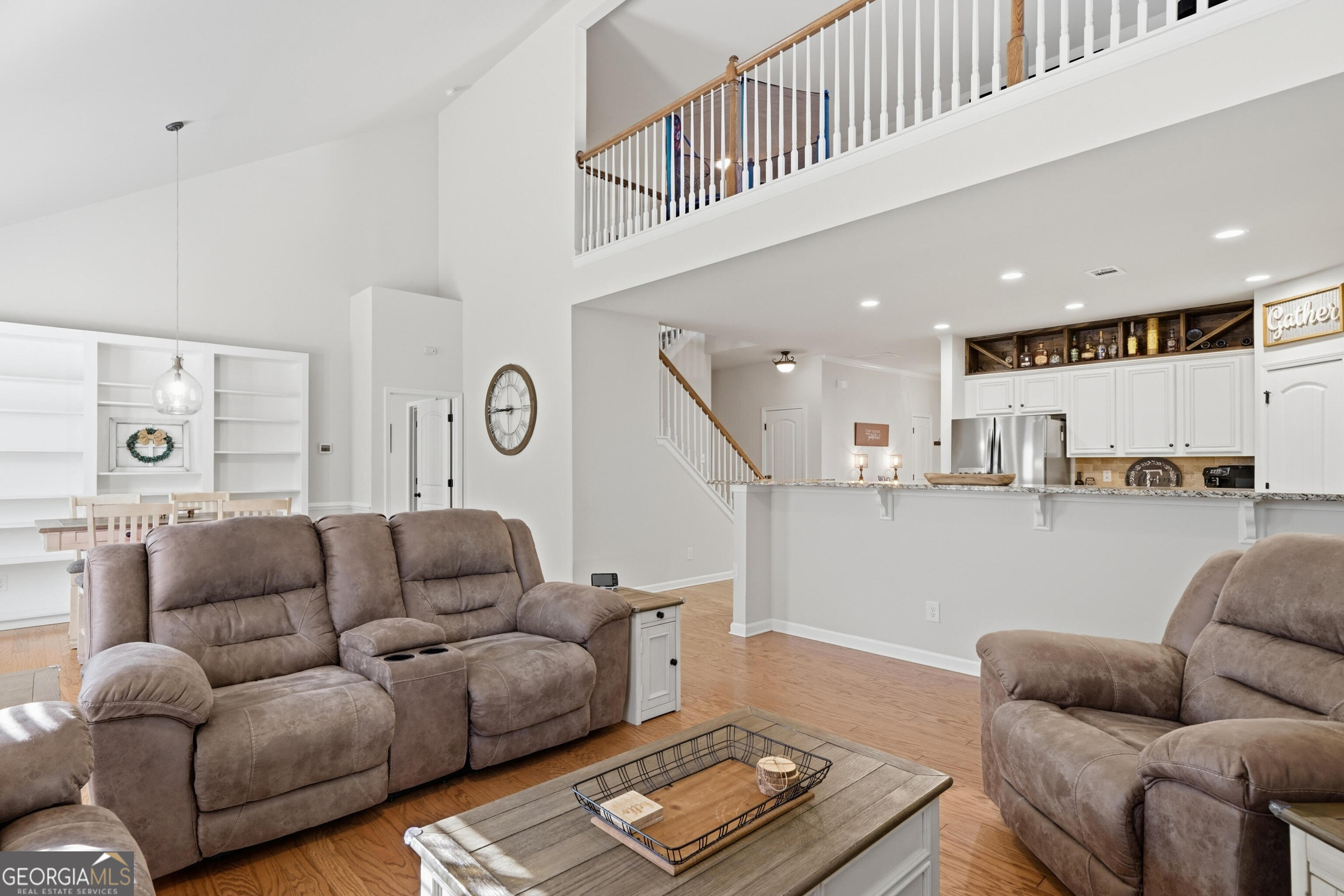 301 Stoney Hollow Road Canton, GA 30114 - Photo 25 of 47 a living room with furniture and stairs