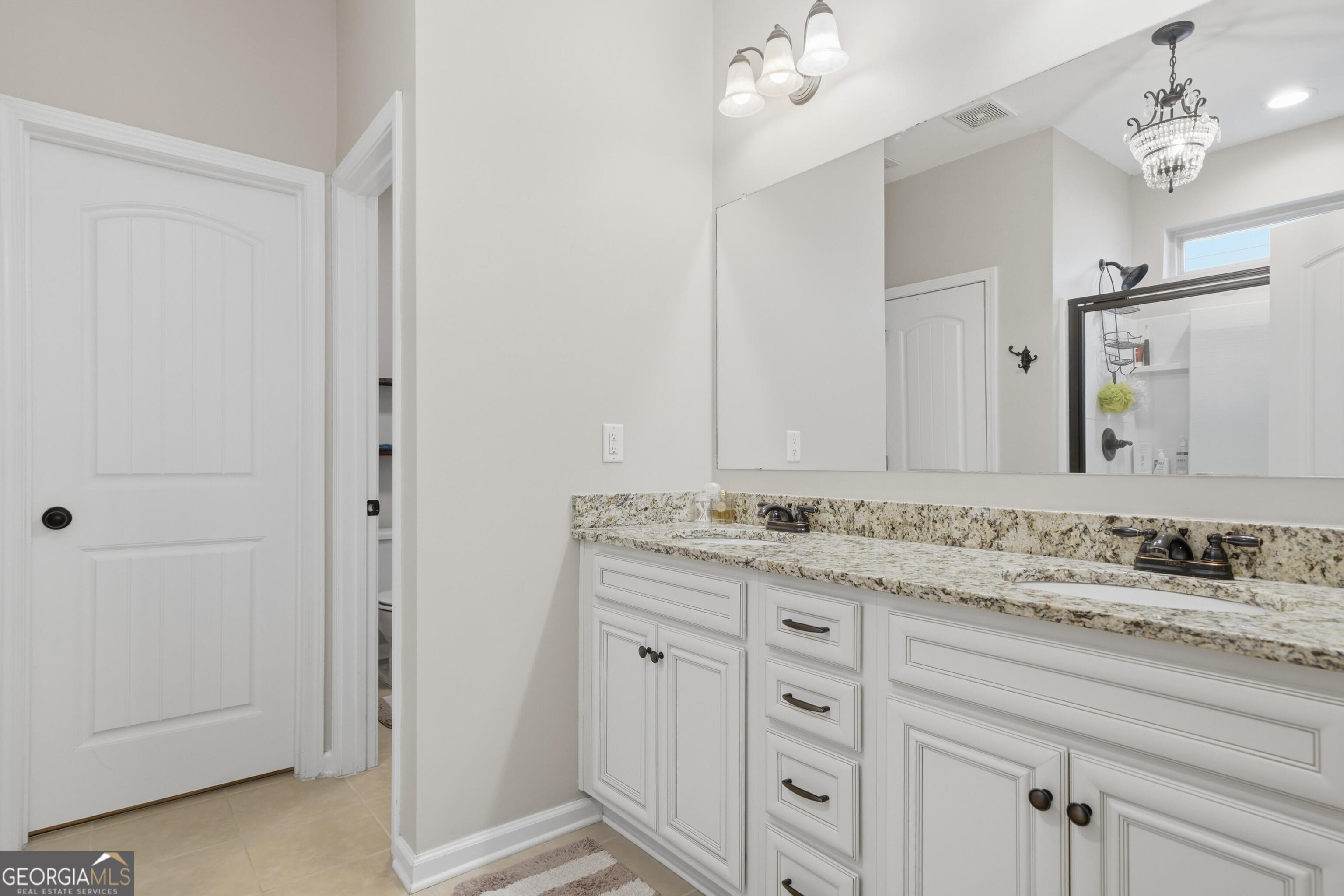 301 Stoney Hollow Road Canton, GA 30114 - Photo 30 of 47 a bathroom with a granite countertop sink and a mirror