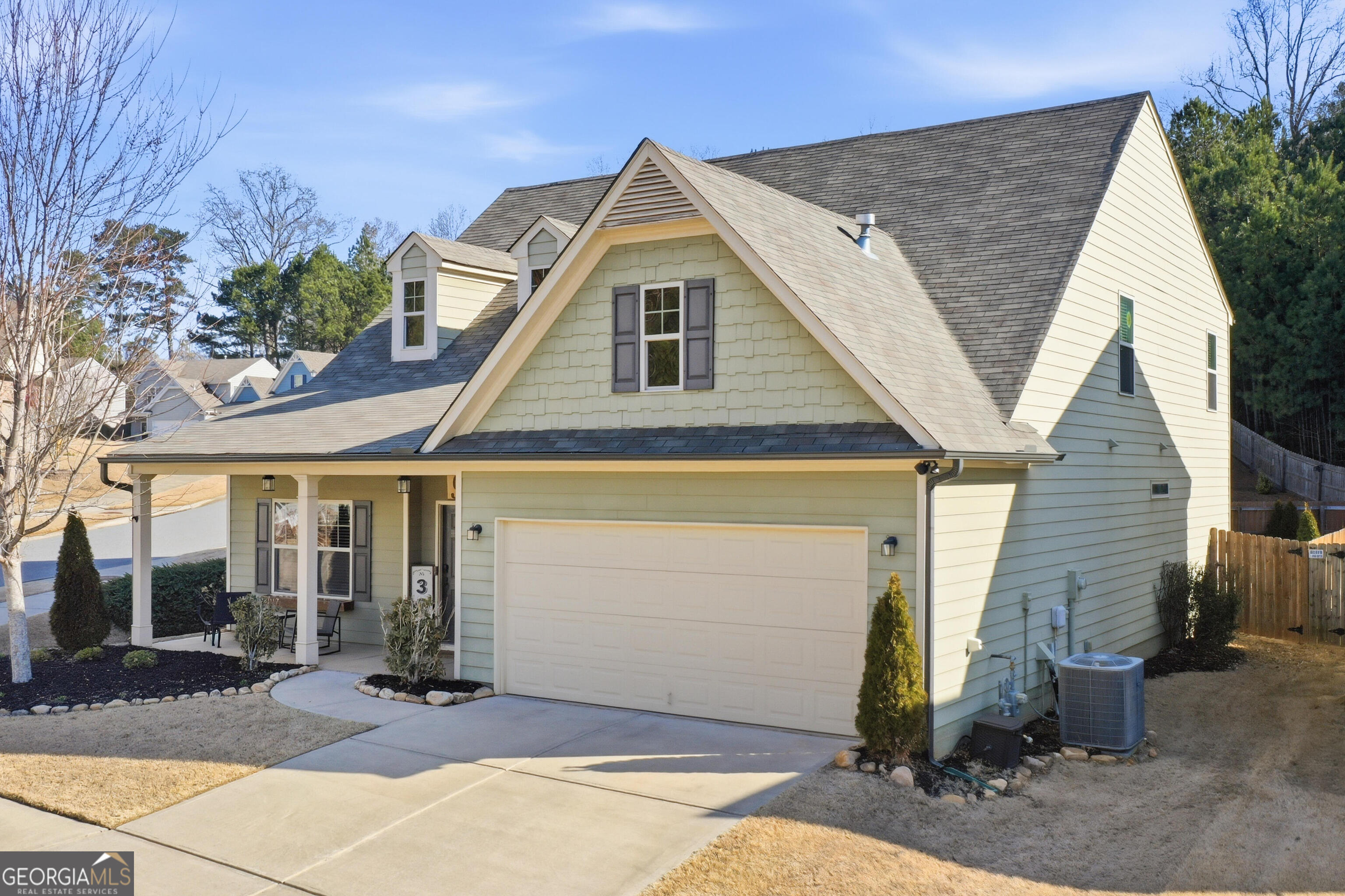 301 Stoney Hollow Road Canton, GA 30114 - Photo 3 of 47 a front view of a house with garden