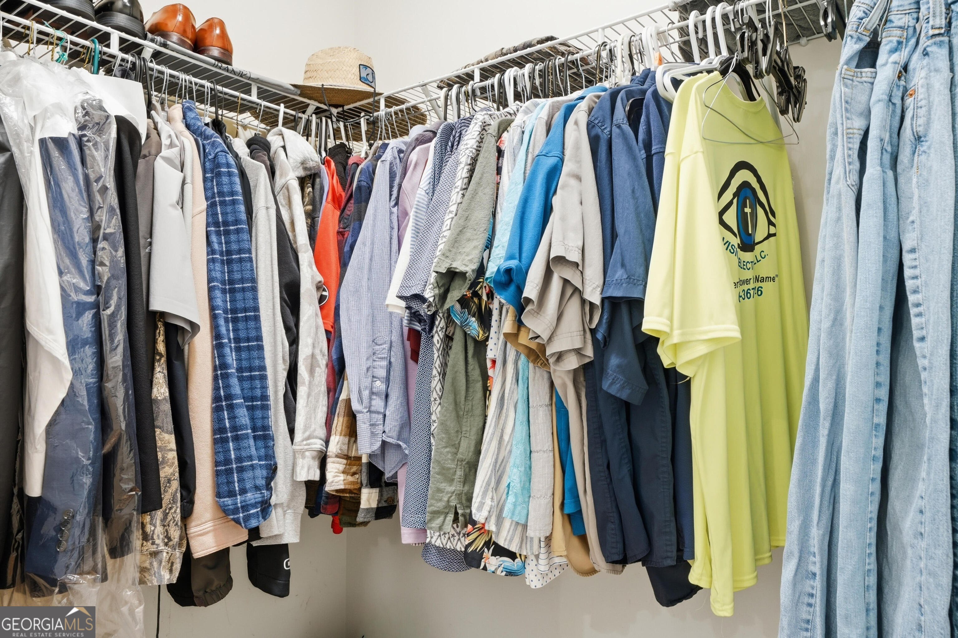 301 Stoney Hollow Road Canton, GA 30114 - Photo 33 of 47 a view of walk in closet with clothes and shoes