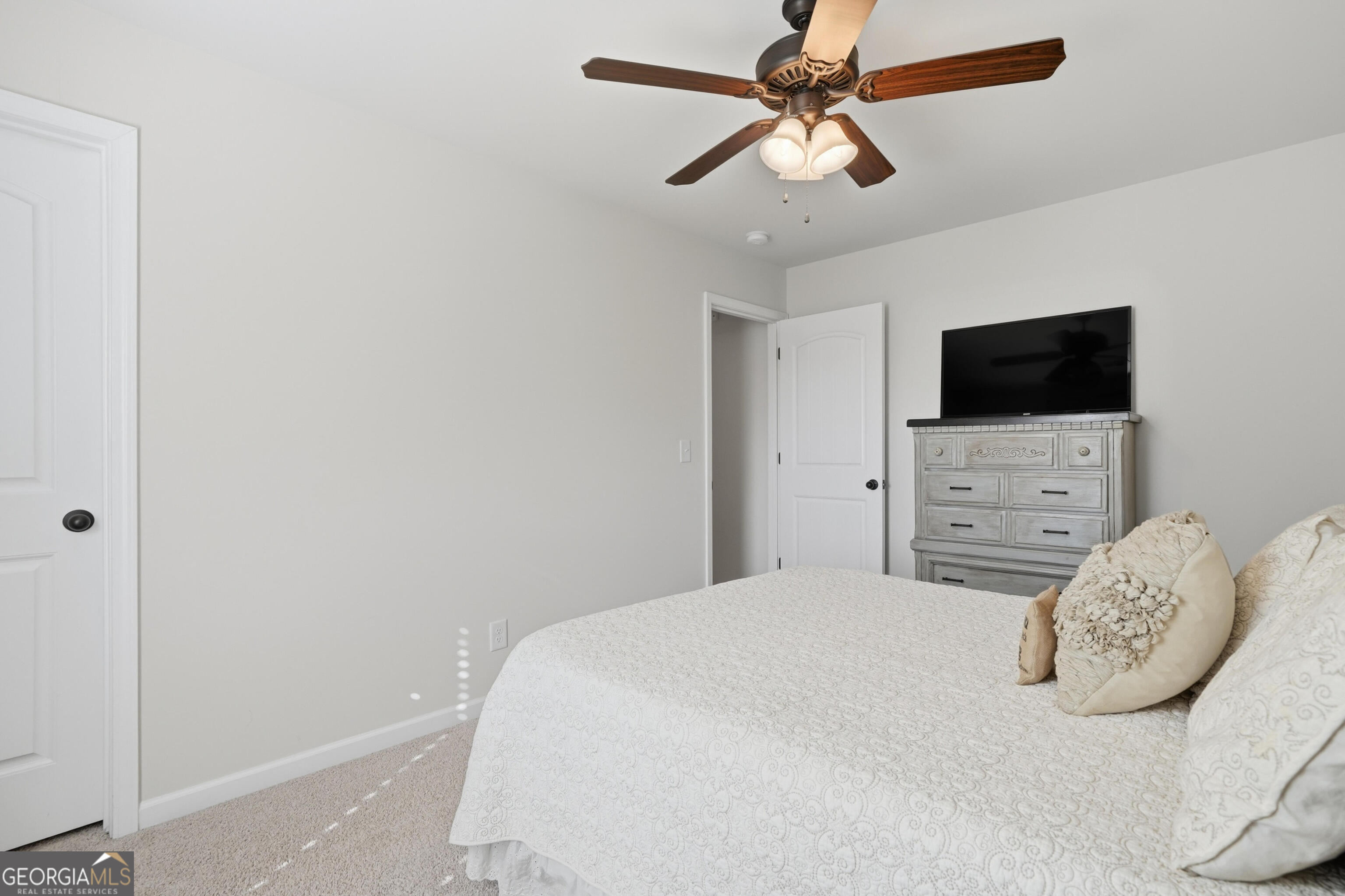 301 Stoney Hollow Road Canton, GA 30114 - Photo 40 of 47 a bedroom with a bed and a flat screen tv