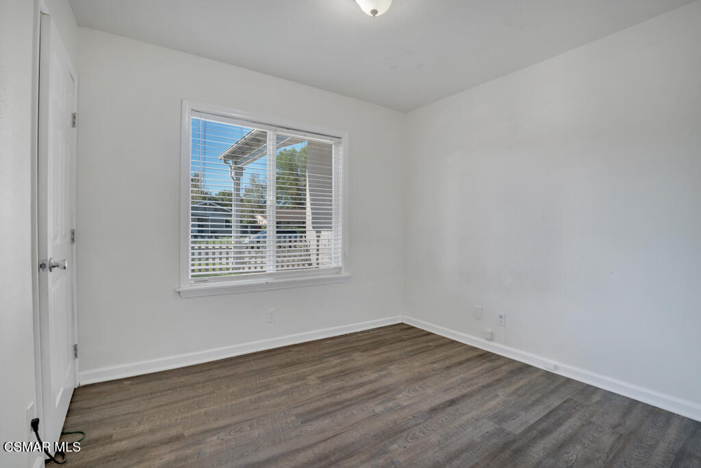 2353 Bryson Place Simi Valley, CA 93065 - Photo 12 of 31 an empty room with wooden floor and windows